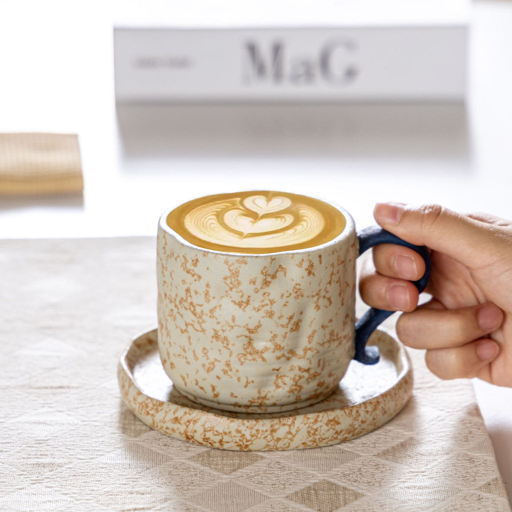 Wabi-sabi style ceramic coffee cup and saucer set