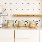 Wabi-sabi style ceramic coffee cup and saucer set