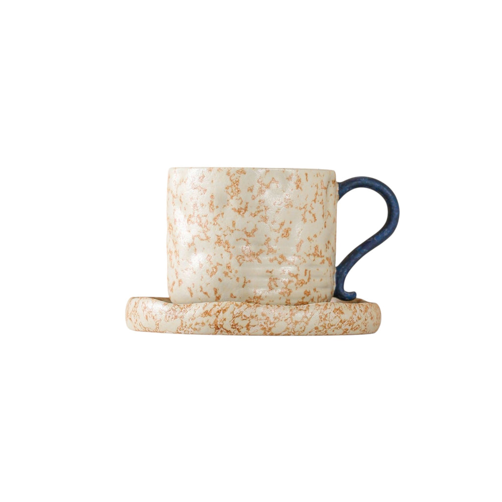 Wabi-sabi style ceramic coffee cup and saucer set