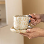 Wabi-sabi style ceramic coffee cup and saucer set