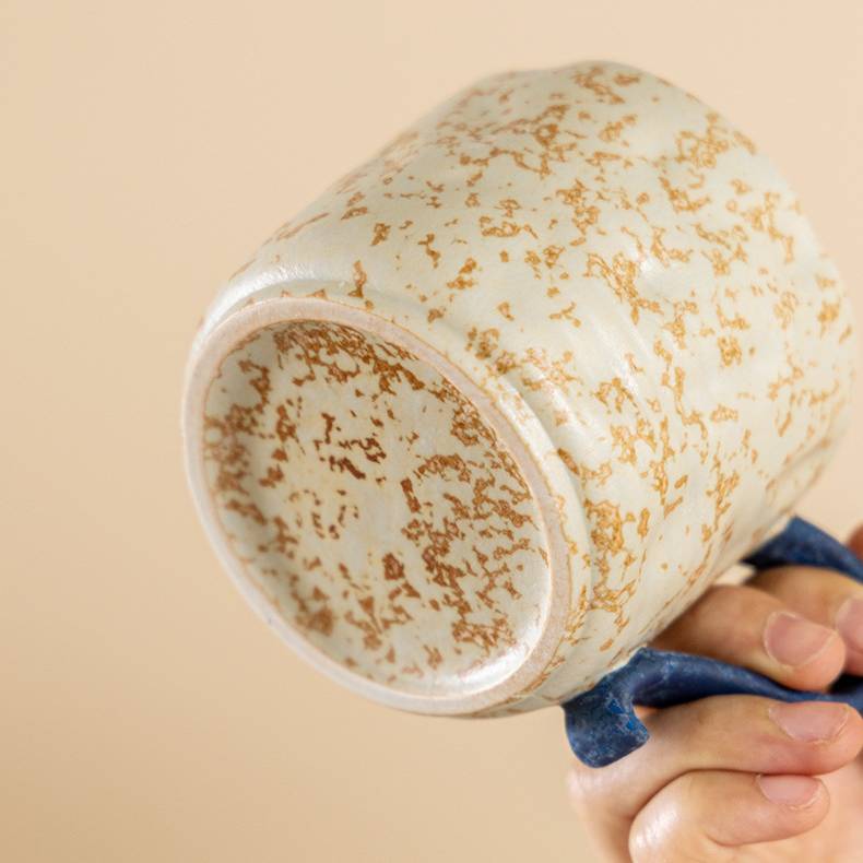 Wabi-sabi style ceramic coffee cup and saucer set